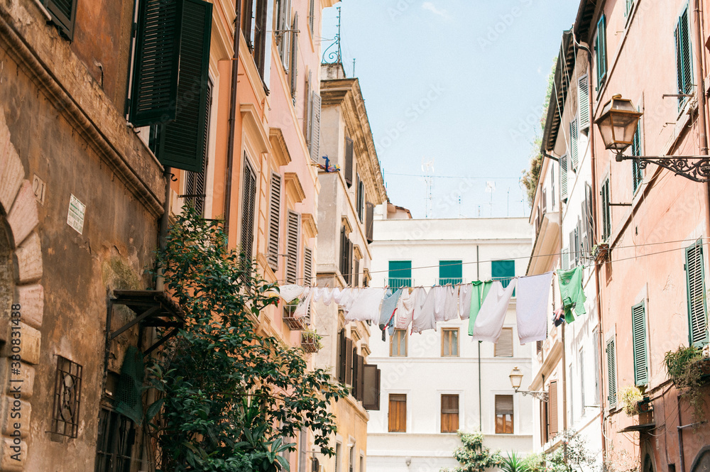 Linens and Clothing Hung out to Dry on a Clothesline in a Neighborhood in Rome Linens and Clothing Hung out to Dry on a Clothesline in a Neighborhood in Rome