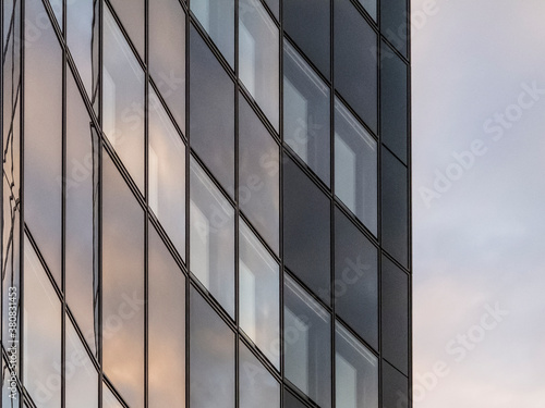 Wallpaper Mural sunlight is reflected in the facade of a highrise Torontodigital.ca
