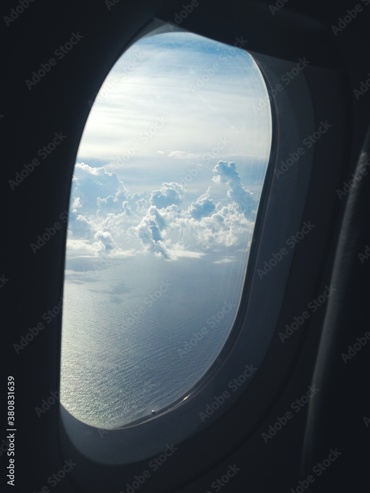 Clouds viewed from an airplane porthole Clouds viewed from an airplane porthole