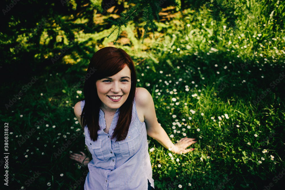 Beautiful red hair woman on green spring background Beautiful red hair woman on green spring background