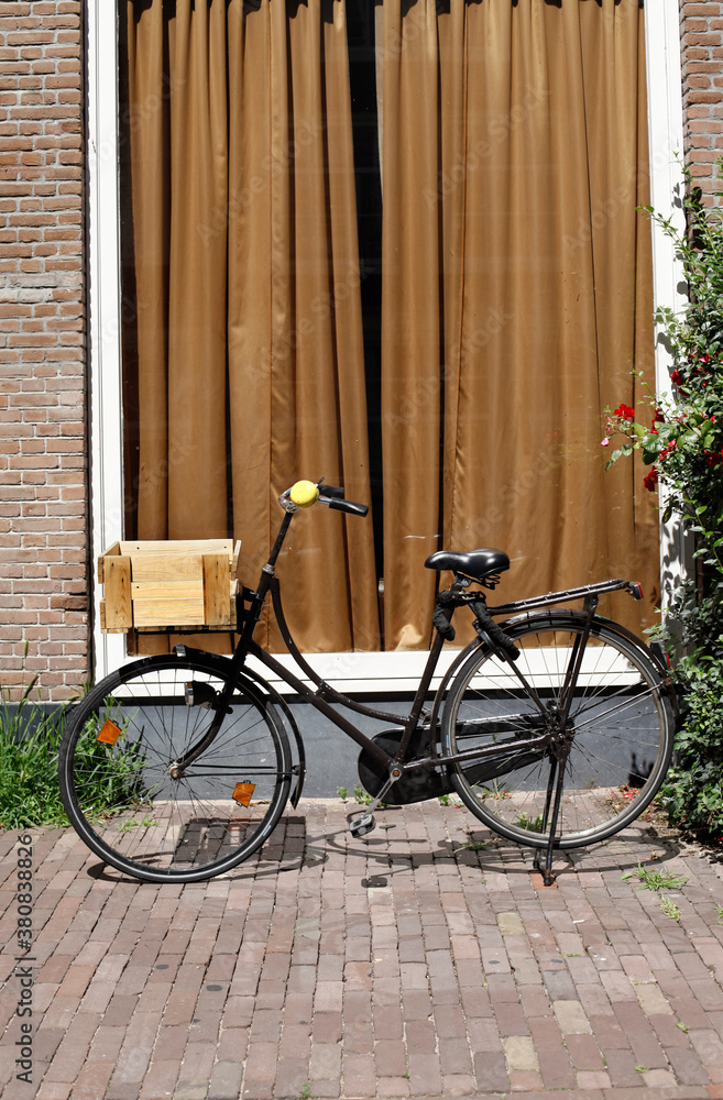 bicycle in front of window