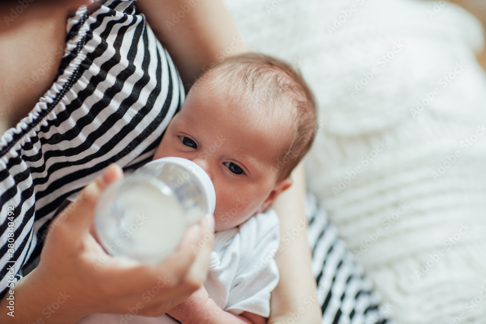 Mother Bottle Feeding Her Baby Mother Bottle Feeding Her Baby