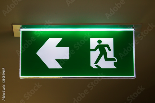 The safety green sign symbol for go to the fire exit. 