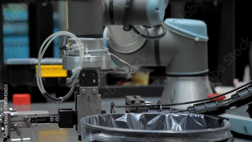 Industrial robot at work in the factory of plastic products.