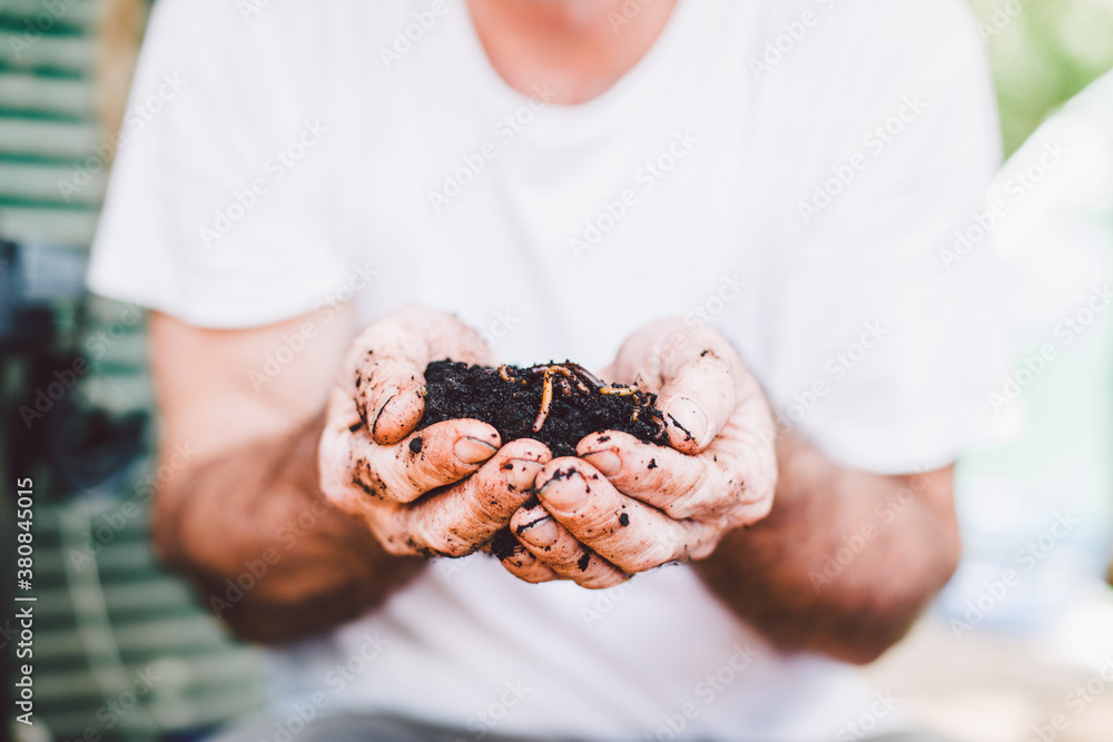 Close up hands of man holding worm for gardening Close up hands of man holding worm for gardening