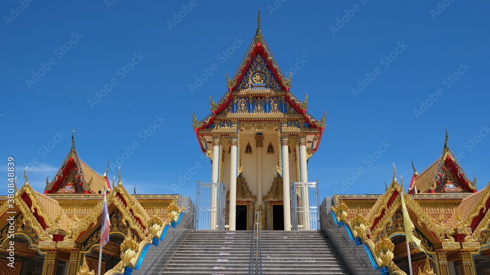 Gorgeous buddhist temple soars into blue sky