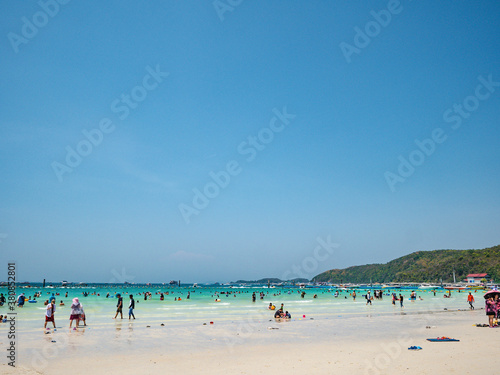 Chonburi/Thailand - 20 apr 2019:Unacquainted Tourists in Tropical Idyllic Ocean and Boat on Koh lan Island in vacation time. Koh lan island is the Famous island near Pattaya city thailand