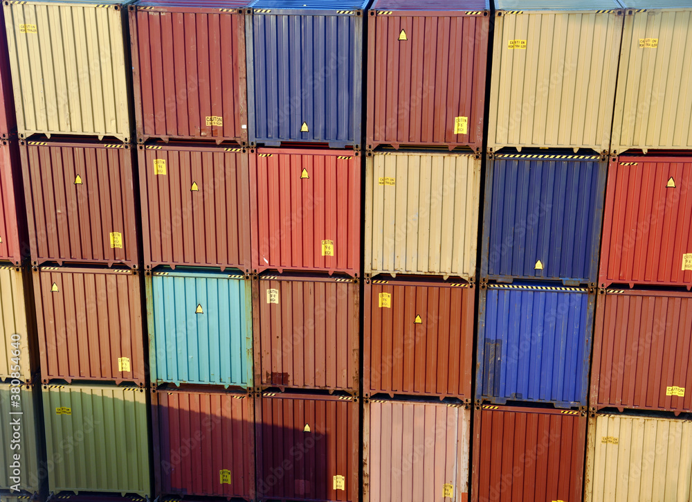 Fototapeta premium View on the stacks of the containers loaded on deck of the cargo ship.