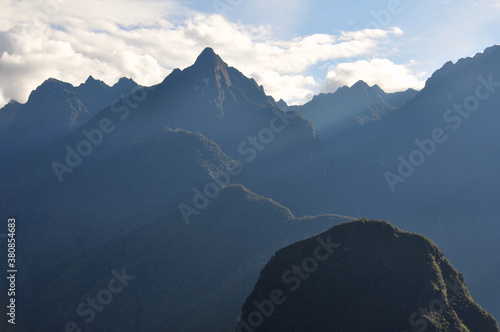 Early morning light from sunrise on the mountains surrounding the ancient Incan city of Machu Picchu in Peru