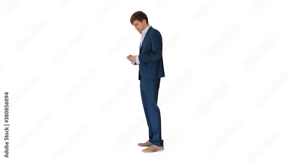 Happy businessman counting money and tucking it inside a jacket pocket on white background. Happy businessman counting money and tucking it inside a jacket pocket on white background.