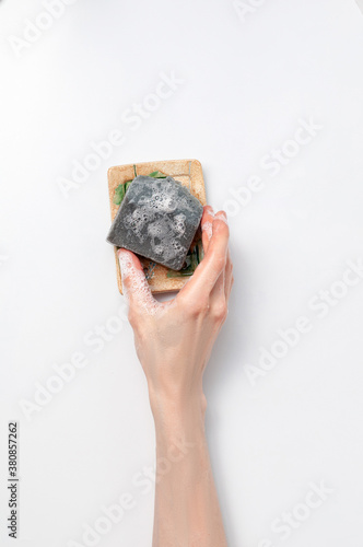 Obraz na płótnie Woman holding natural handmade soap bar on white background w salonie
