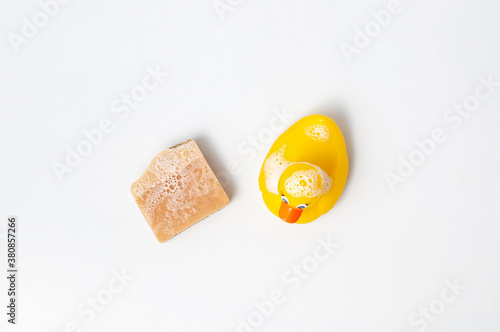 Obraz na płótnie Natural handmade soap bar with rubber duck on white table w salonie