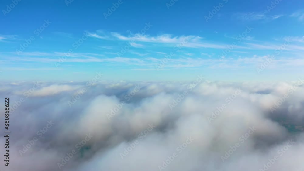 White clouds with blue sky. Aerial Flight above and through the moving cloudscape. Texture of clouds. Panoramic view. Clouds in motion
White clouds with blue sky. Aerial Flight above and through the moving cloudscape. Texture of clouds. Panoramic view. Clouds in motion