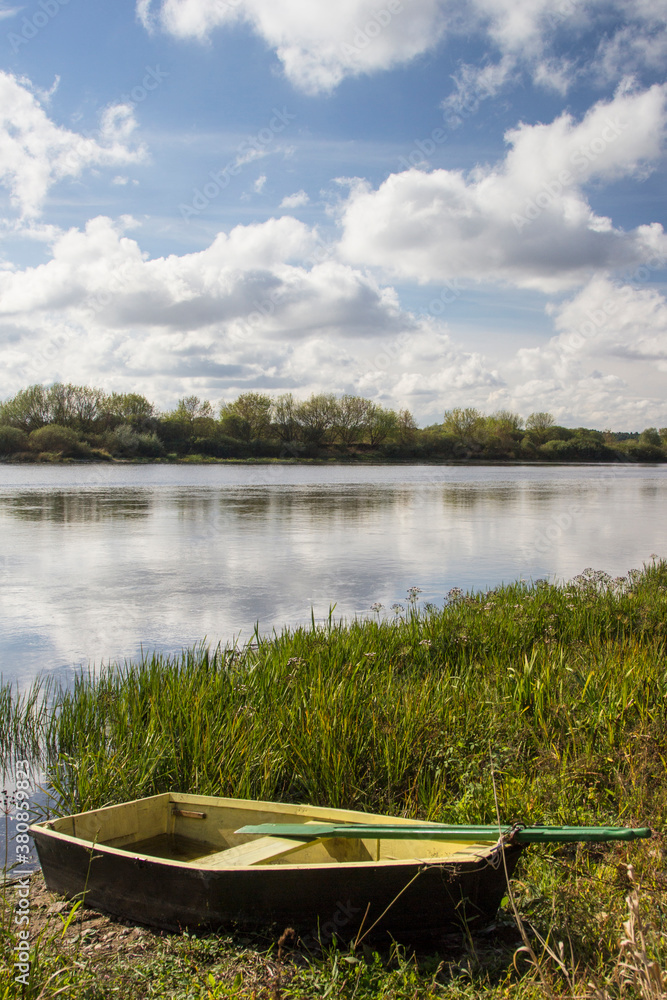 Lithuania, Vilkija - Boat rests on the shore of the Nemunas river Lithuania, Vilkija - Boat rests on the shore of the Nemunas river