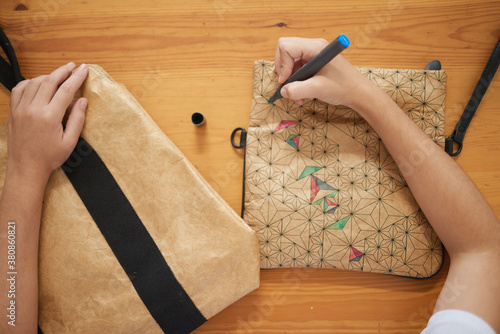 a young woman creating a handmade bag photo