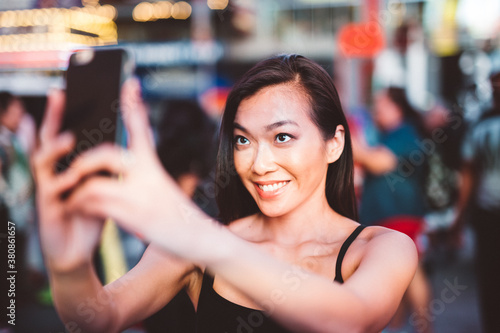 Wallpaper Mural Asian woman taking a selfie in Time Square Torontodigital.ca