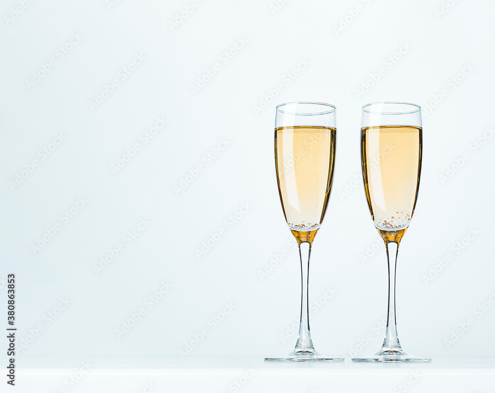 two wine glasses on a gray background two wine glasses on a gray background