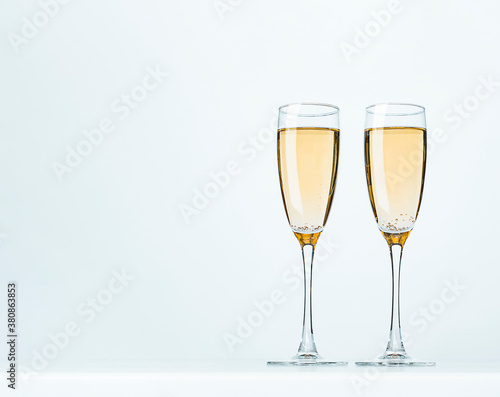 two wine glasses on a gray background