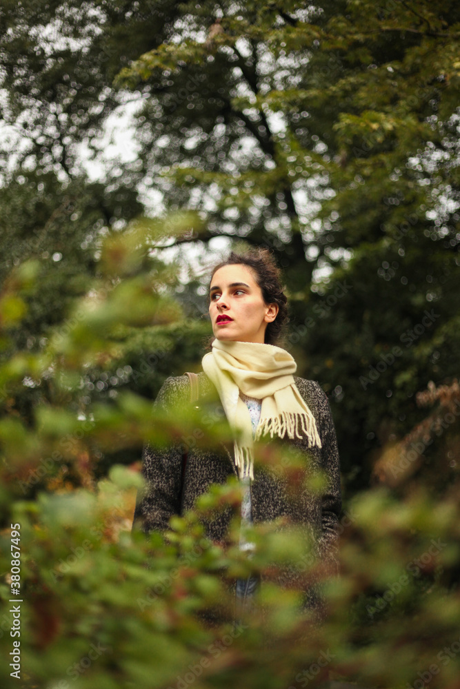 Young woman through the branches Young woman through the branches