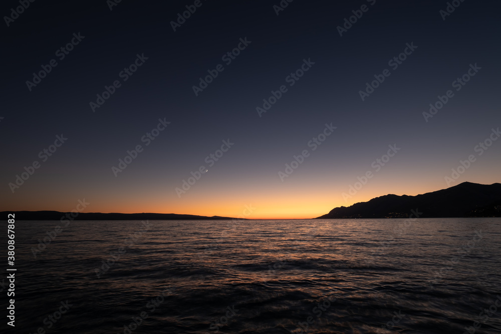 Waves on the sea surface and sky as a background. Seascape during sunset. Nature composition. Mediterranean sea.