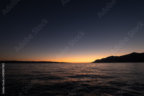 Waves on the sea surface and sky as a background. Seascape during sunset. Nature composition. Mediterranean sea.