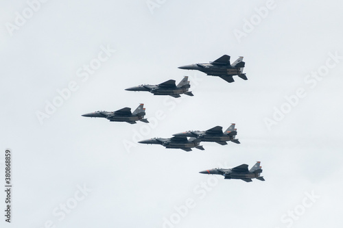 Photography Singapore Air Force F15 fighter jets flying over the city during National Day ce