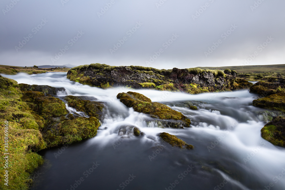 A river flowing rapidly A river flowing rapidly