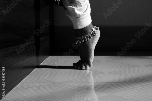 Canvas Print Indian girl child silver anklet isolated in bare feet