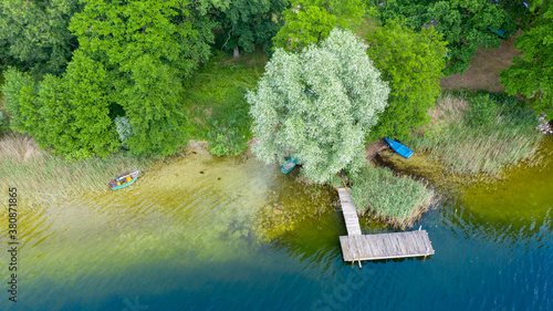 Fotografie, Tablou Aerial view of the Karskie lake shore with footbridge and boats in Kinice, Polan