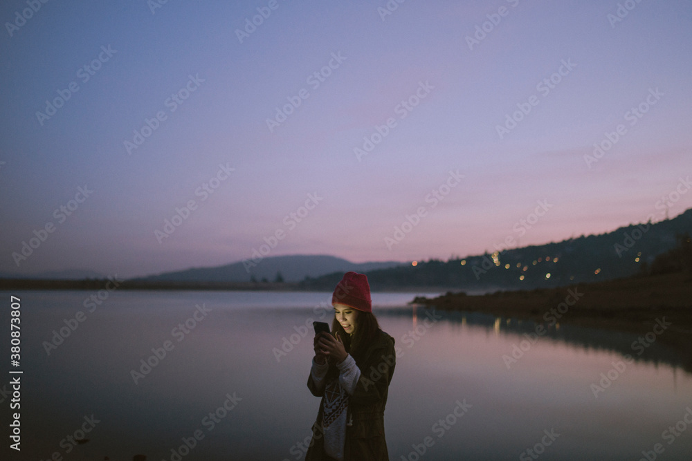 Beatiful woman on a lake
