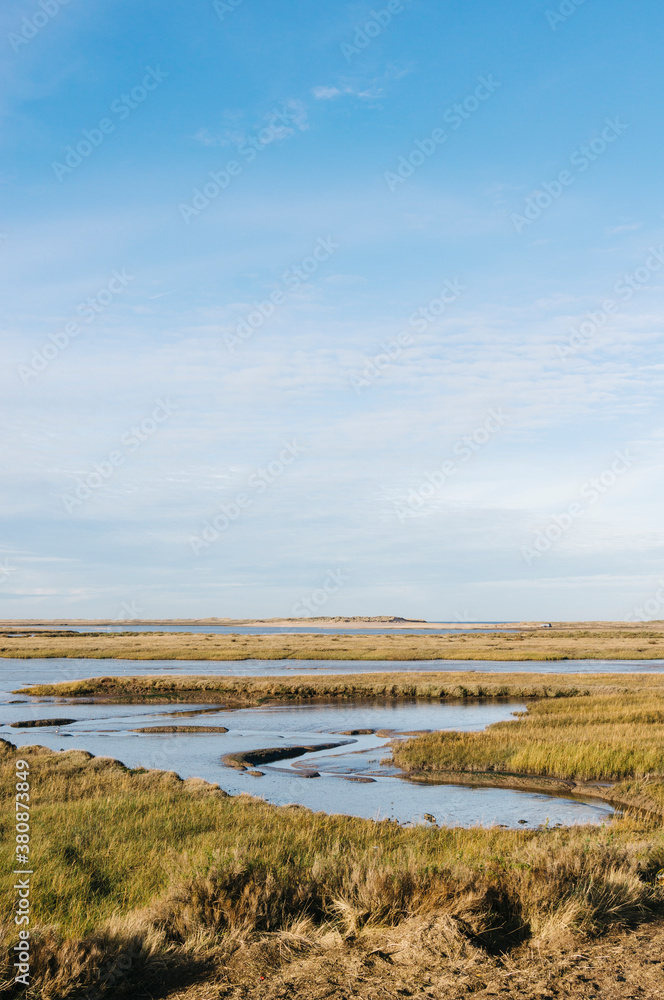 Low tide salt marsh at Burnham Overy Staithe, Norfolk, UK. Low tide salt marsh at Burnham Overy Staithe, Norfolk, UK.