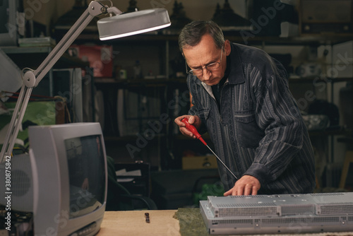 Technician inspecting defective LCD Screen photo