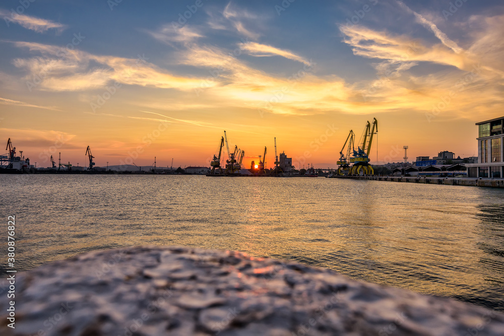 Naklejka premium sunset over the harbor in Burgas city