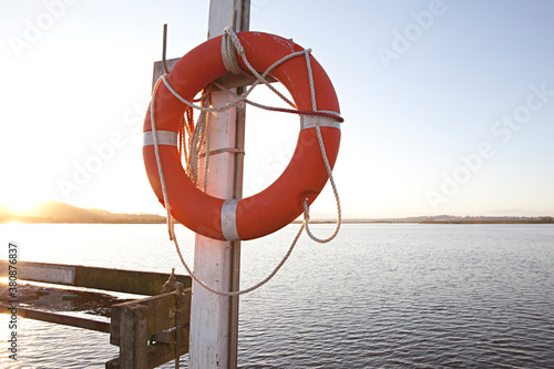 The pier at Marlo, Australia with life buoy at sunset photo