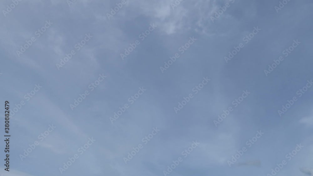Fluffy wispy smoke cloud & cirrus or cirrostratus cloudscape moving on pastel blue sky background in tropical summer sunlight & sun rays at sunny daylight sunshine day, dramatic B-roll TimeLapse Fluffy wispy smoke cloud & cirrus or cirrostratus cloudscape moving on pastel blue sky background in tropical summer sunlight & sun rays at sunny daylight sunshine day, dramatic B-roll TimeLapse