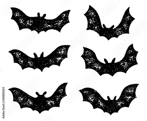 Grunge flying bat silhouettes