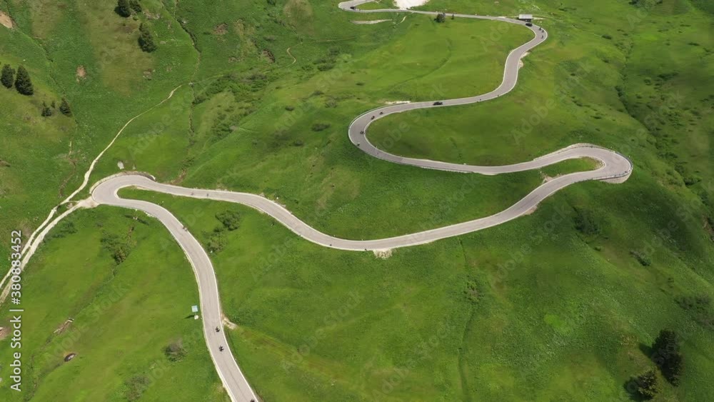 Drone flight of traffic (cars and motorbikes) driving over hairpin roads leading up to mountain pass in the Dolomites in Italy
Drone flight of traffic (cars and motorbikes) driving over hairpin roads leading up to mountain pass in the Dolomites in Italy