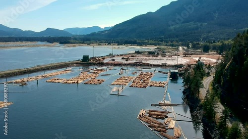 Log booms with mountains in background photo