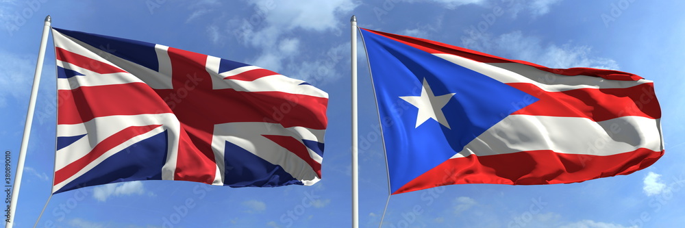 Flying flags of the United Kingdom and Puerto Rico on high flagpoles. 3d rendering Flying flags of the United Kingdom and Puerto Rico on high flagpoles. 3d rendering
