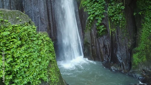 Beautiful waterfall in Bali, Indonesia. Lokasi Air Terjun Kuning Waterfall. photo