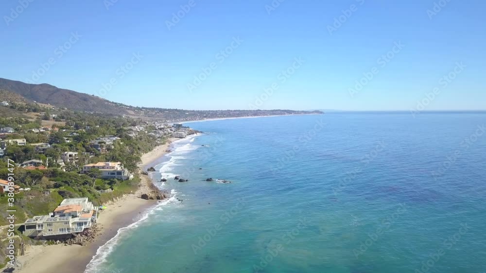 Drone shot of pacific coast with beach houses moving forward Drone shot of pacific coast with beach houses moving forward