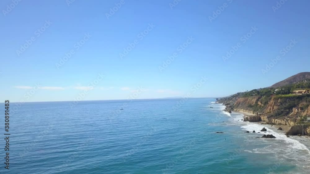 Rising drone shot of pacific coast moving forward and slowly tilting down Rising drone shot of pacific coast moving forward and slowly tilting down