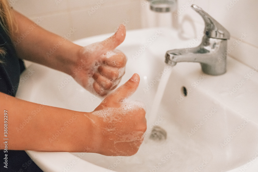 Washing of hands with soap under running water Washing of hands with soap under running water