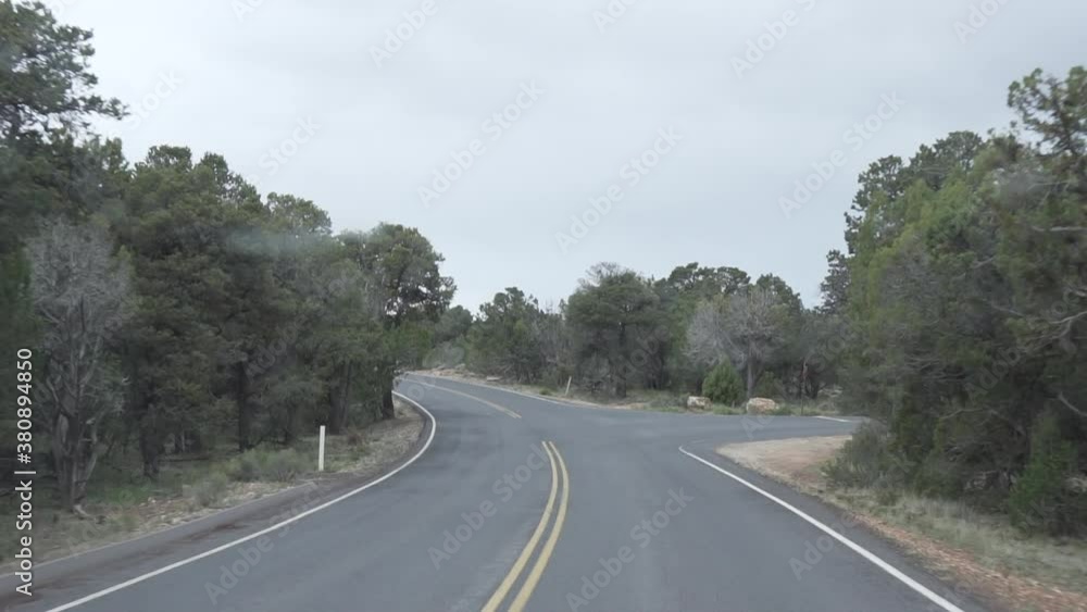 Driving through a long, curved road. Slow motion. Driving through a long, curved road. Slow motion.