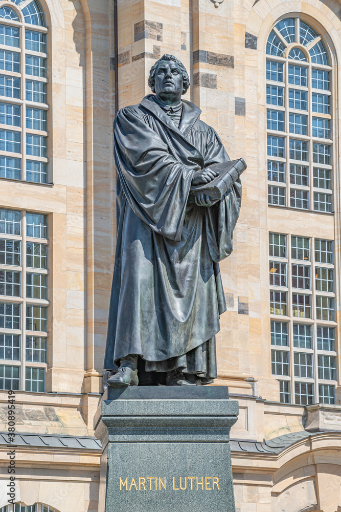 Obraz premium Monument of Martin Luther at Neumarkt square in downtown of Dresden, a theologist, composer, priest, who has started Reformation in Catholic Church, Germany, details, closeup..