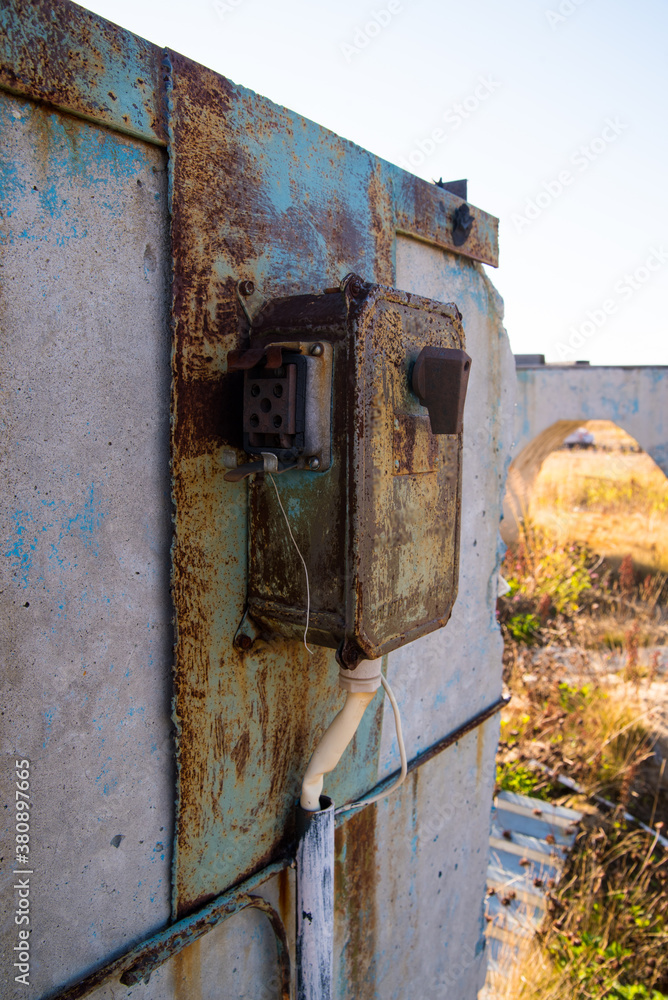 Old electric switch on a concrete wall