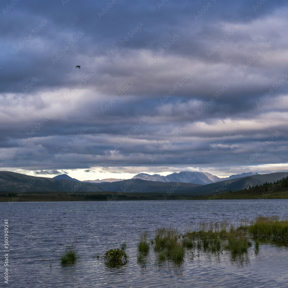 Cloudy landscape on the Ilchir lake. Siberia, Eastern Sayan mountains