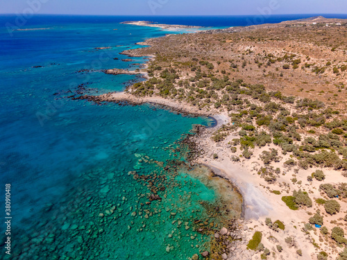 Crete Coast Line with turquoise colored water and lonely Beach from Top 