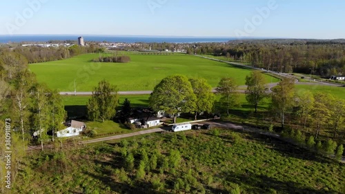 pull back shot of rural area overlooking a city and a lake in the background photo