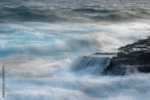 Wallpaper Mural Rocky seashore with wavy ocean and waves crashing on the rocks. Torontodigital.ca